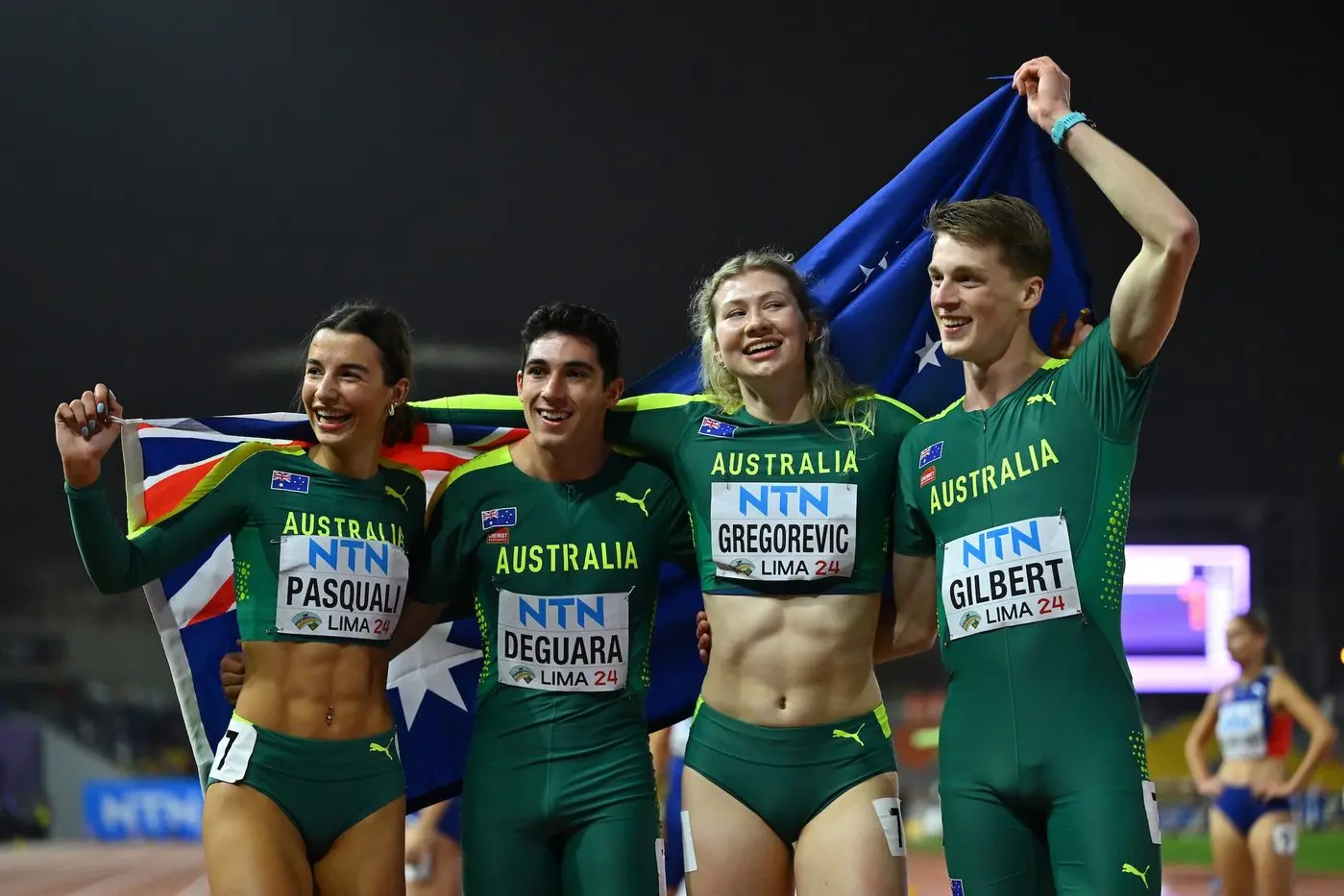 GREEN AND GOLDEN: Bella Pasquali (left), Jack Deguara, Sophia Gregorevic and Jordan Gilbers took home mixed 4x400m gold on Wednesday morning. PHOTO: World Athletics