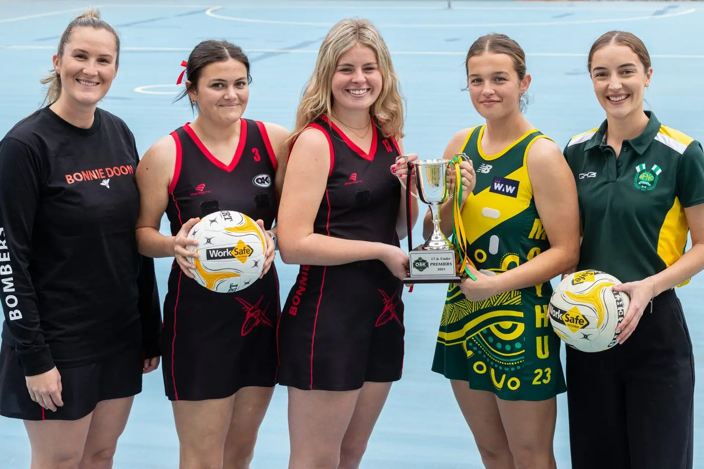 THE BIG DANCE: Amy Starzer and her Bombers, led by Amy Cash and Tilly Thornton, take on Mia Ford and Jacqueline Lake\\'s Hoppers for the 17 and under netball premiership. PHOTO: Marc Bongers