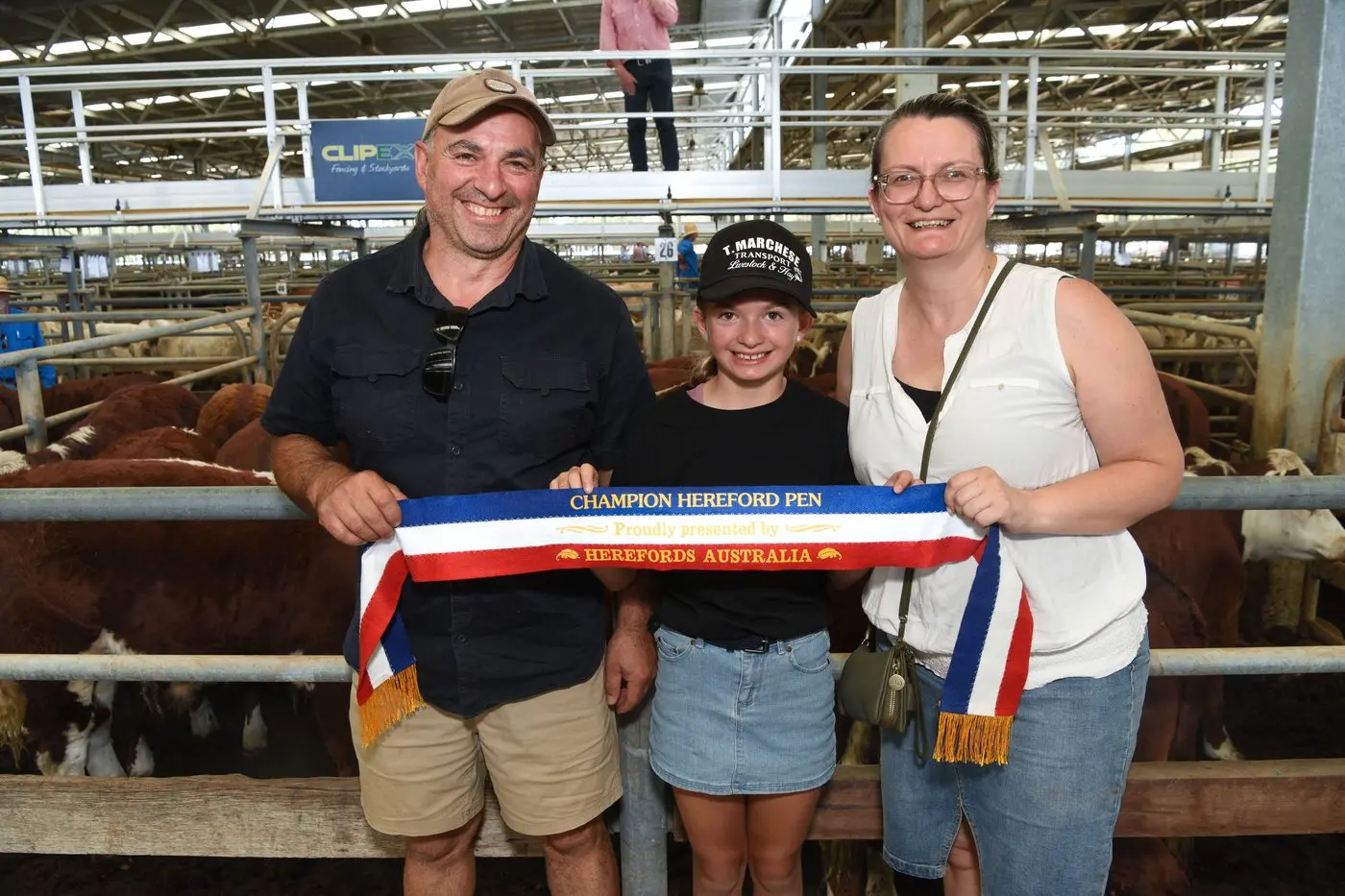TOP HONOURS: Maindample cattle producers Tony and Elena Marchese with Vincenza Di Filippo were awarded top price for the champion Hereford pen at the Wangaratta Livestock Exchange sale on Friday. PHOTO: Kurt Hickling