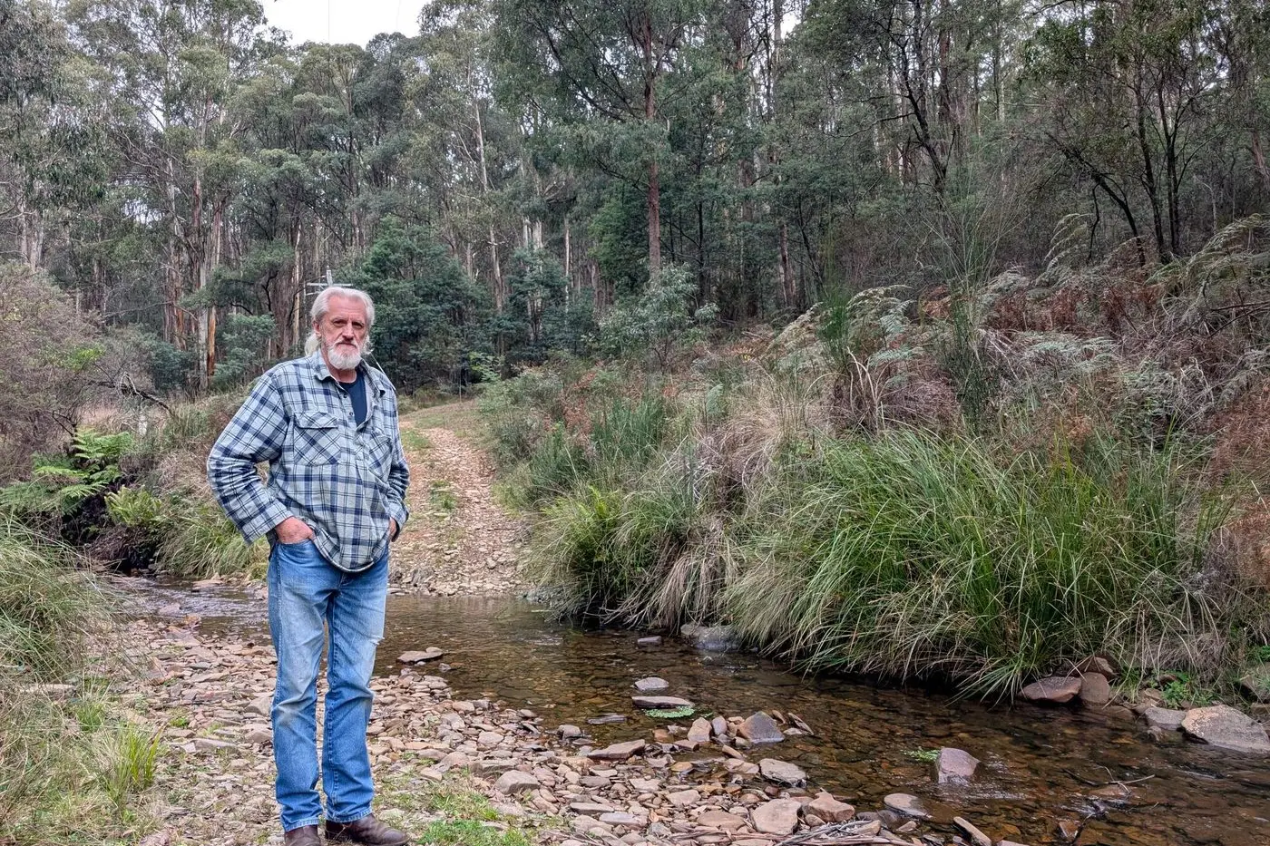 STEADY HAND: Woods Point\\'s Tony Rugys has lived behind \"enemy lines\" in the High Country bush for more than 50 years. He says wild dogs are bolder than ever, and fears restrictions on hunting and bush access will leave locals exposed.