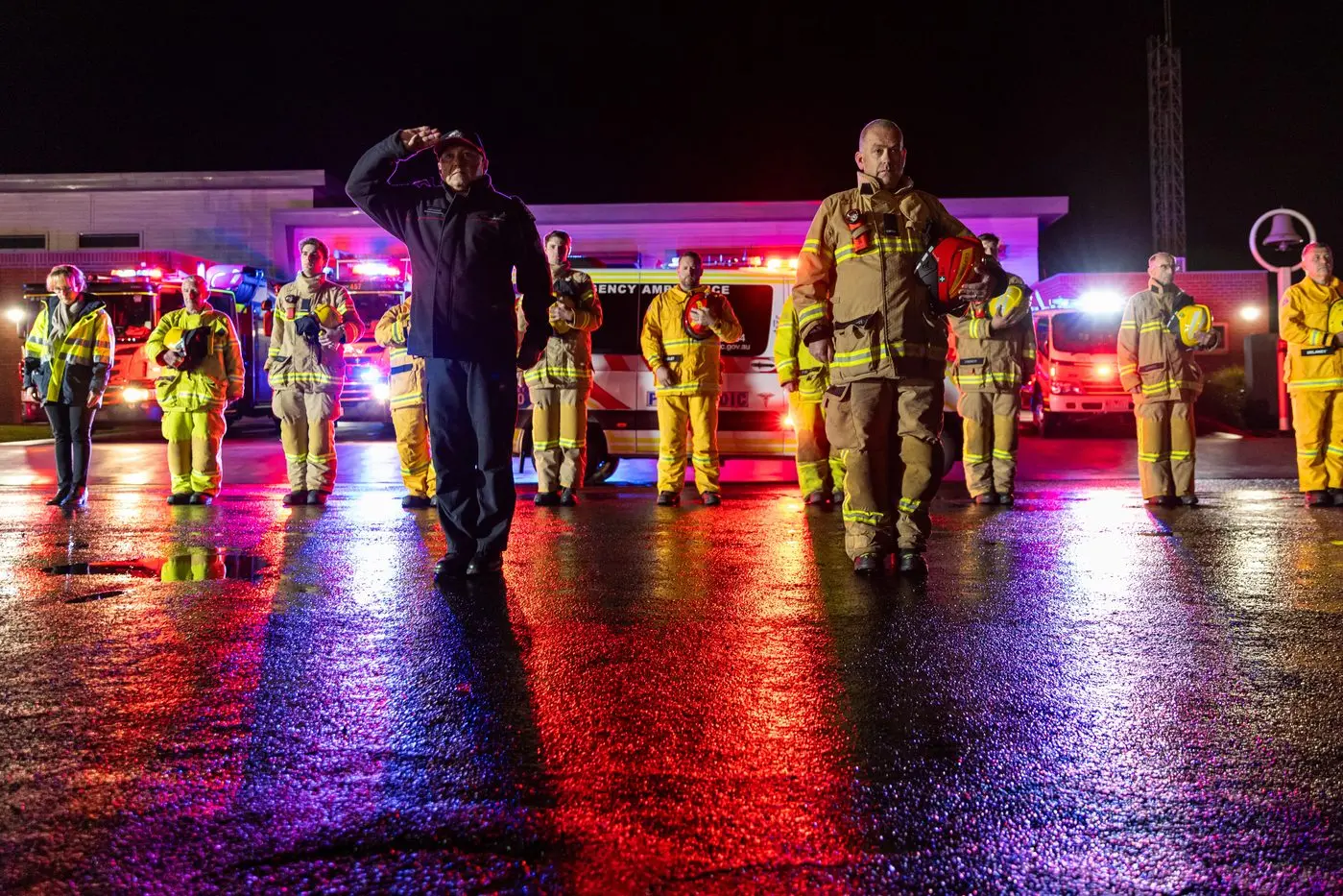 MARK OF RESPECT: CFA District 23 Assistant Chief Fire Officer Stewart Kreltszheim and Wangaratta CFA captain Jason Allisey led a tribute to Victoria Police from local emergency service personnel on Thursday night. PHOTOS: Marc Bongers
