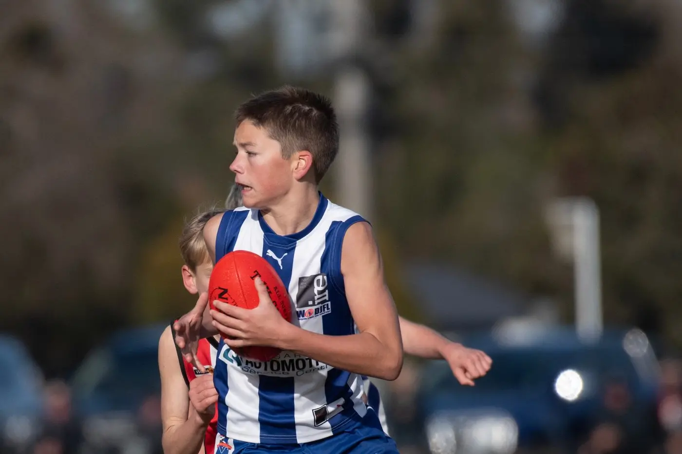 PIVOT: Luke Kelly evades a chasing Myrtleford Saints player on Saturday during the Kangaroos match at North Wangaratta Recreation Reserve. The Roos players have been eager to return to the Wareena Park Oval all season. PHOTO: Melissa Beattie