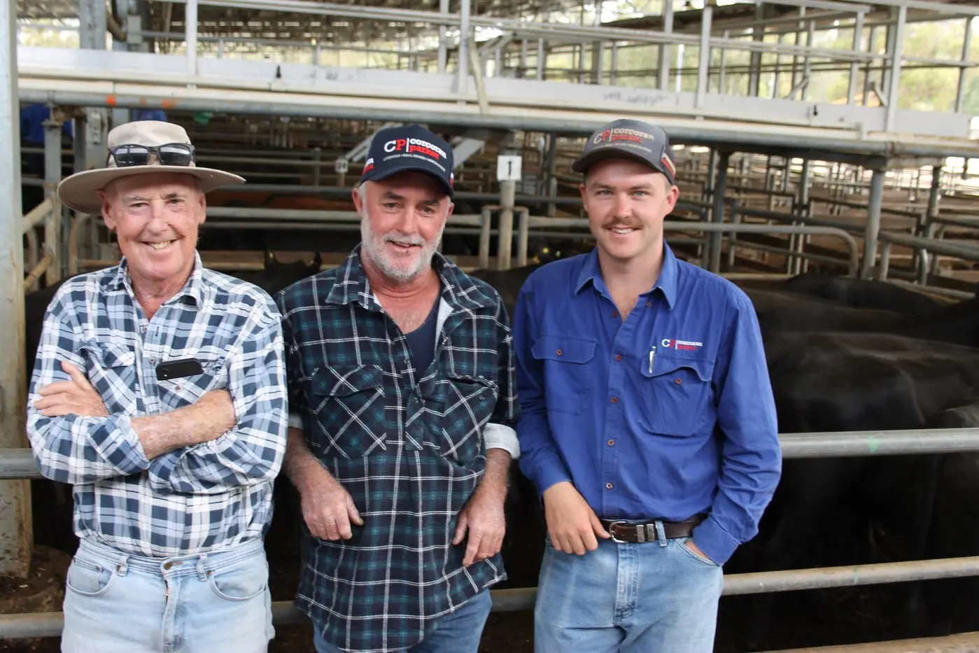 A FAMILY EVENT: Michael Purcell (centre) had a sucessful day at the Wangaratta December Store Monthly sale with father Laurie (left) and son Brady (right) for the herd dispersal of the Yarck property managed by Michael. PHOTO: Bailey Zimmermann