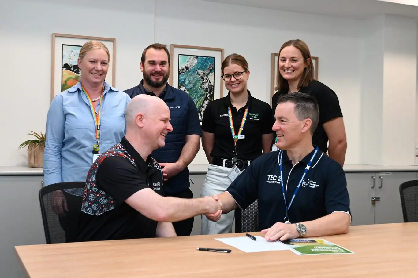 PARTNERS IN BETTER HEALTH: (Top from left) Linda Hudec (COO AWH), Matt Tolsher (health professional AWH), Lauren Rudd (community paramedic), Alicia Turnbull (community paramedic), Trent Dean (CEO Gateway Health) and William Appleby (CEO AWH) celebrate the expanded partnership delivering better health outcomes.\\n