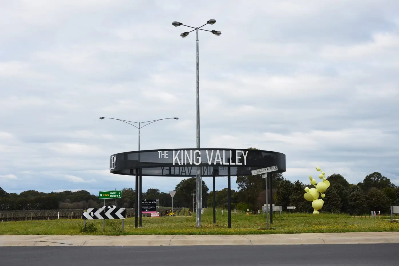 STATEMENT SIGN: A new sign at the intersection of the Snow Road and Wangaratta-Whitfield Road in Oxley, part of a project being managed by Tourism North East, is designed to indicate arrival in the King Valley wine region. PHOTO: Anita McPherson