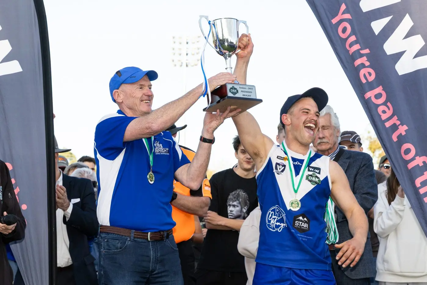CHAMPIONS: Bright coach Michael Quirk and captain Sam Dalbosco raise the premiership cup in triumph. PHOTOS: Marc Bongers
