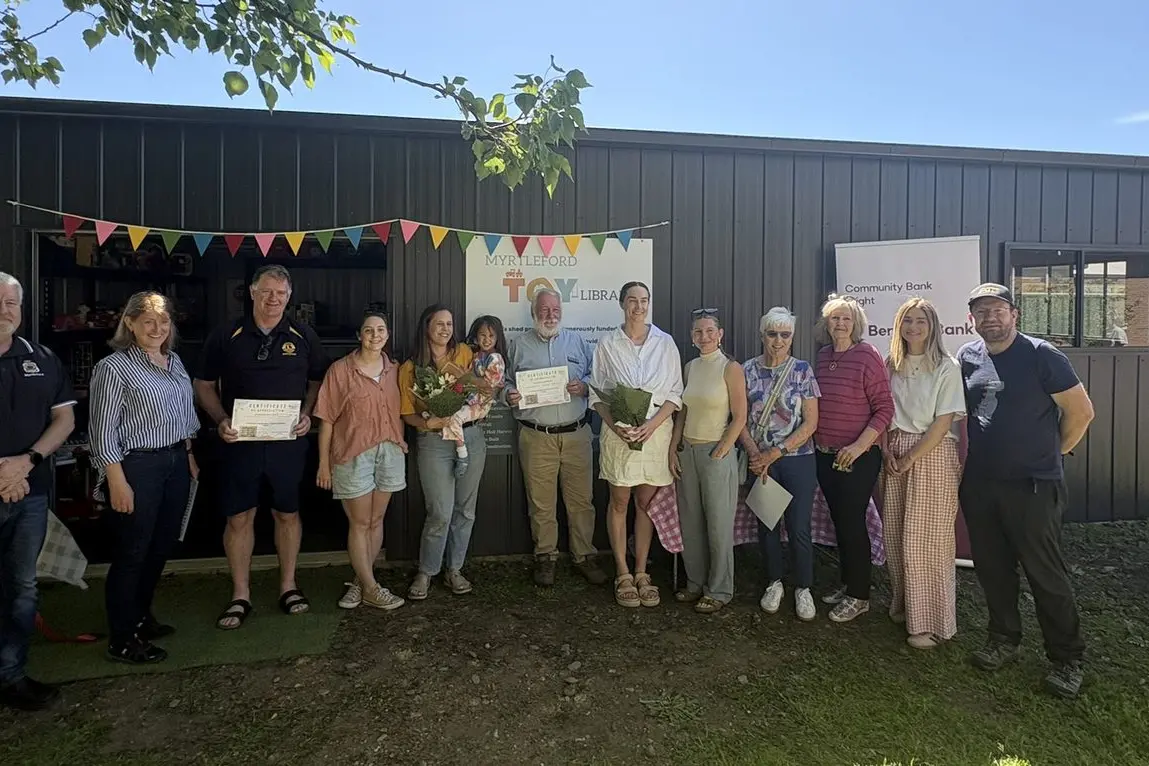 TOY TIME: Celebrating the opening of Myrtleford Toy Library\\'s new shed were (from left) Combined Services Committee member Dave Byrne, GROW Myrtleford+ Fiona Nicholls, Lions club member Paul Tanner, Madi Bruce, Anna Buchanan Old and Dolores Old, Community Bank Bright\\'s Graham Gales, Millicent Wall, Bonnie Goodman, Margaret Curtis, Christine McCracken, Emma Cunneen and Dan Mayoh. PHOTO: Anna Buchanan Old
