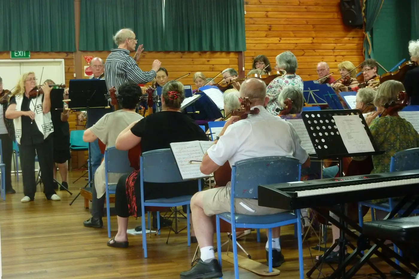 ALPINE ORCHESTRATION: Last year\\'s Music Camp participants rehearsed all together before the end-of-the-week performances, led by Doug Heywood, OAM.
