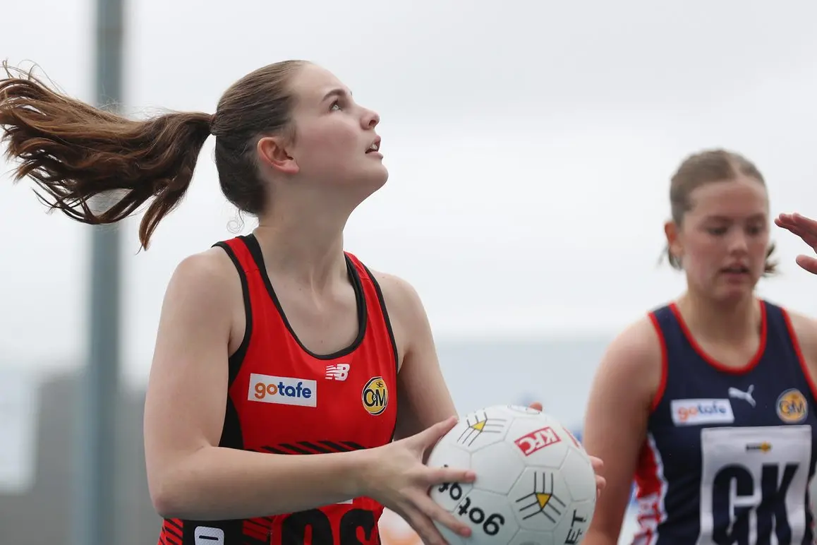 FINISH IT: Izzy Morrison lines up to shoot in the Saints\\' 15 and under netball grand final on Sunday. PHOTOS: Melissa Beattie