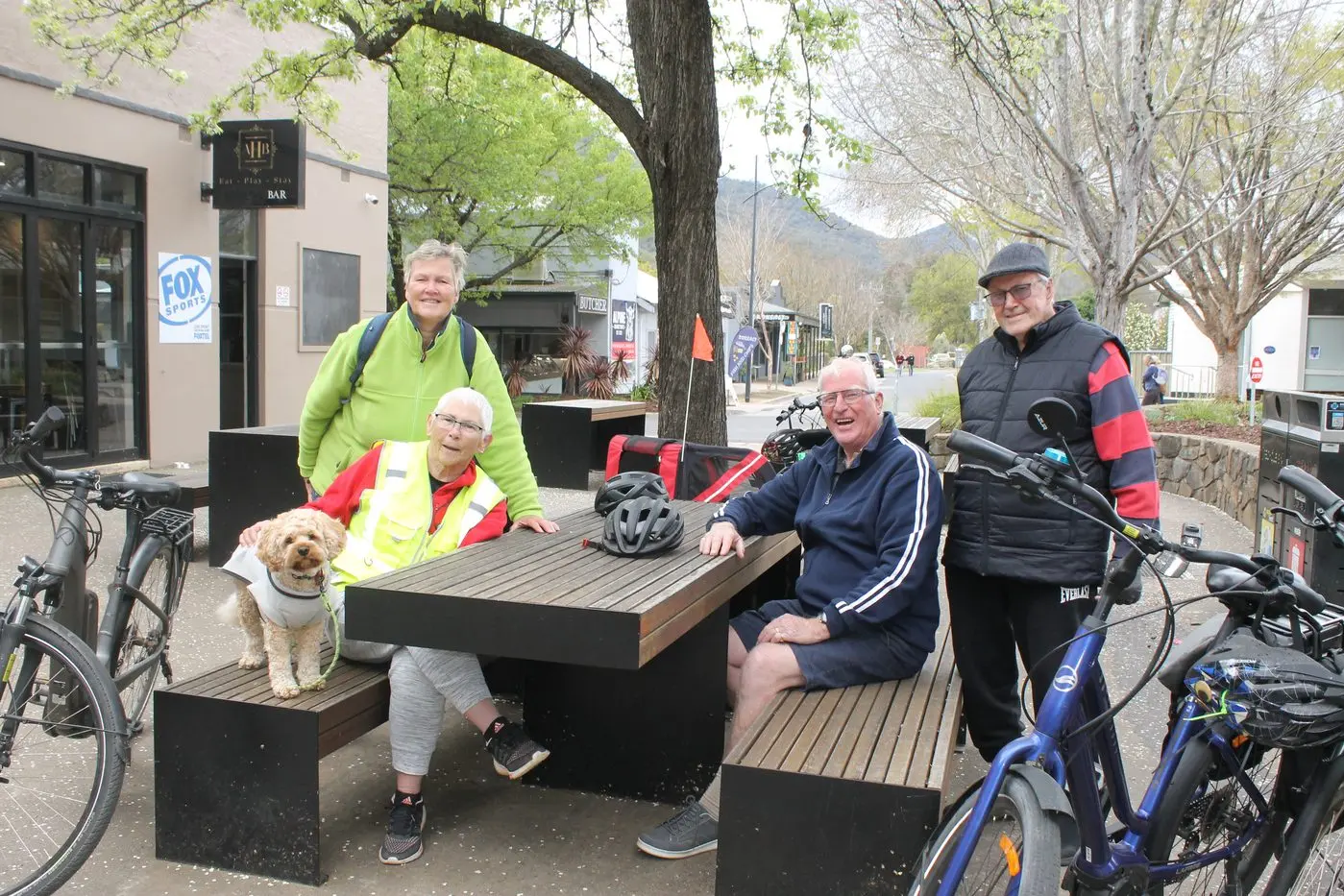 PRIORITIES BEFORE PEDALING: After enjoying a trip to Nightingales\\' Apples last week, Lottie the Cavoodle, Kitty Mooij, Marie Thomas, Rudolf Mooij and Jan-Piet Thomas were going to cycle straight back to Porepunkah, but Rudolf suggested a stop at the Alpine Hotel in Bright. PHOTO: Phoebe Morgan