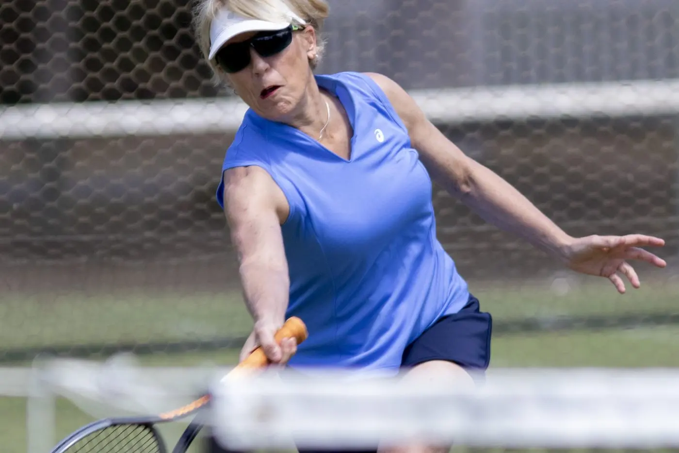 FULL STRETCH: Cate Campbell shows excellent court coverage to reach a low volley. PHOTOS: Dale Mann
