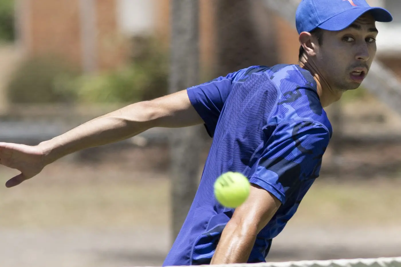 SLICING AND DICING: Matt Teasdale shows epic balance as he returns this backhand slice. PHOTOS: Dale Mann