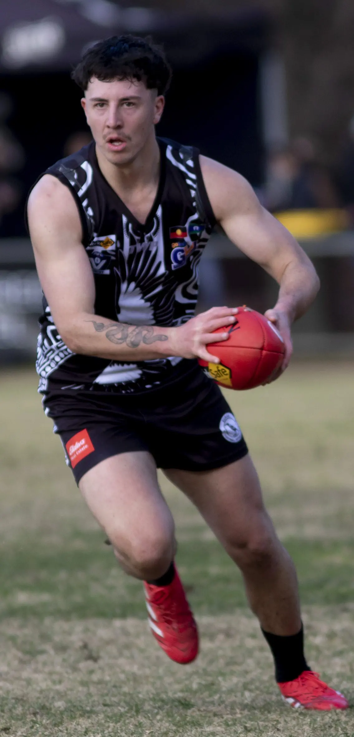 SURGING AHEAD: Darby Wilson muscles forward on the field, powering through the contest. PHOTOS: Dale Mann\\n\\n\\n\\n\\n