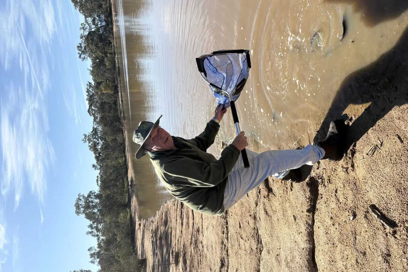 FISHING OPPORTUNITY STOCKED UP: Don Adams unloads a netful of fish. This Sunday you are invited to fish the dam at the Arb\\' for some freshly released trout. Over 300 pan-sized rainbows were released into the dam on Monday 15 September in anticipation of fun for all the family. The event is being run by the Strathbogie-Euroa Angling Club and will be held at the Euroa Arboretum on Sunday 21 September 9:30am-2:30pm.