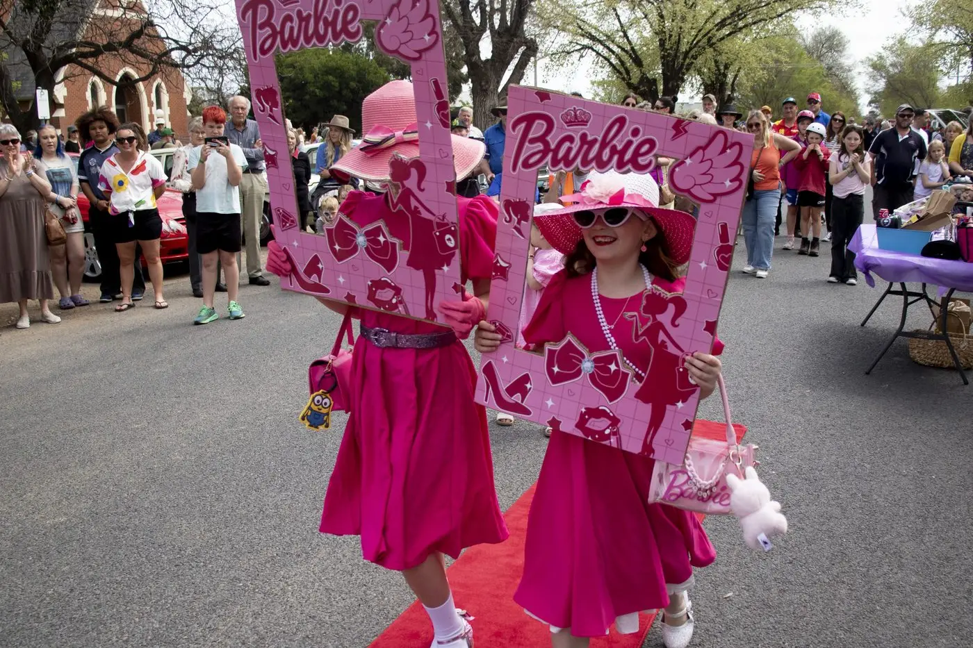 SISTERS SHINE AT THE SHOW: A shy Ella Hard, 10, and her sister Evie, 7, took out line honours of a different sort on the celebrated catwalk at this year\\'s Mitchelton Show & Shine . PHOTO: Dale Mann