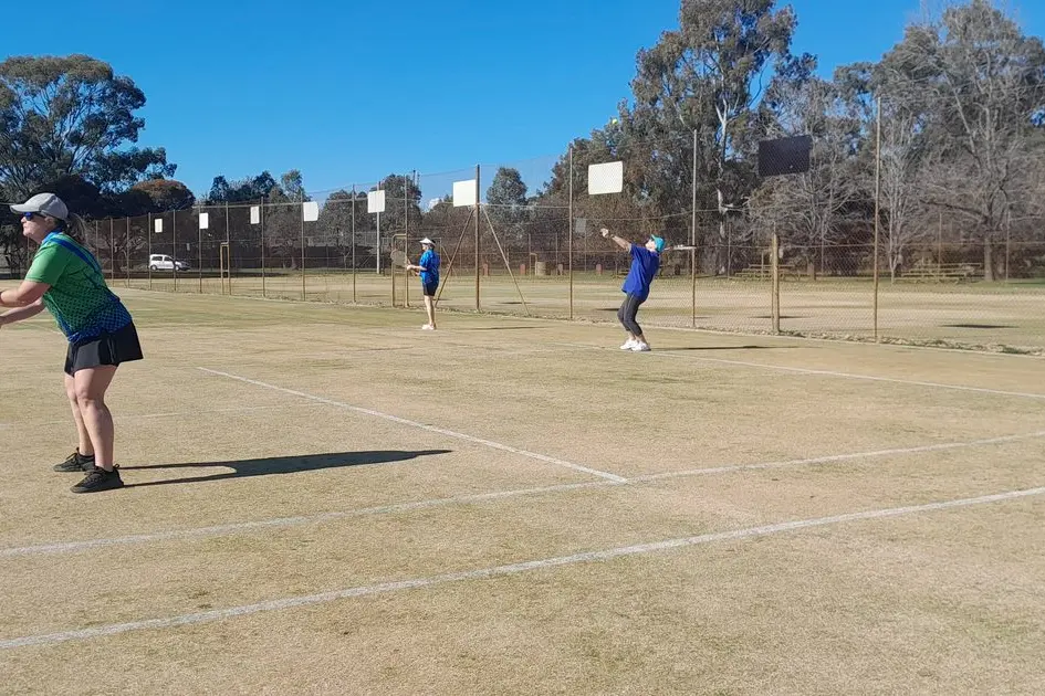GETTING THE POINT: Carolyn Murray at the net as Karyn Fraser serves.