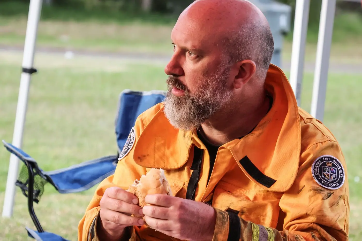 A BREAK FROM THE BLAZE BATTLE: A volunteer at the Grampians takes time for a donated meal and some contemplation before heading back to the fire front.\\nPHOTO: RRT