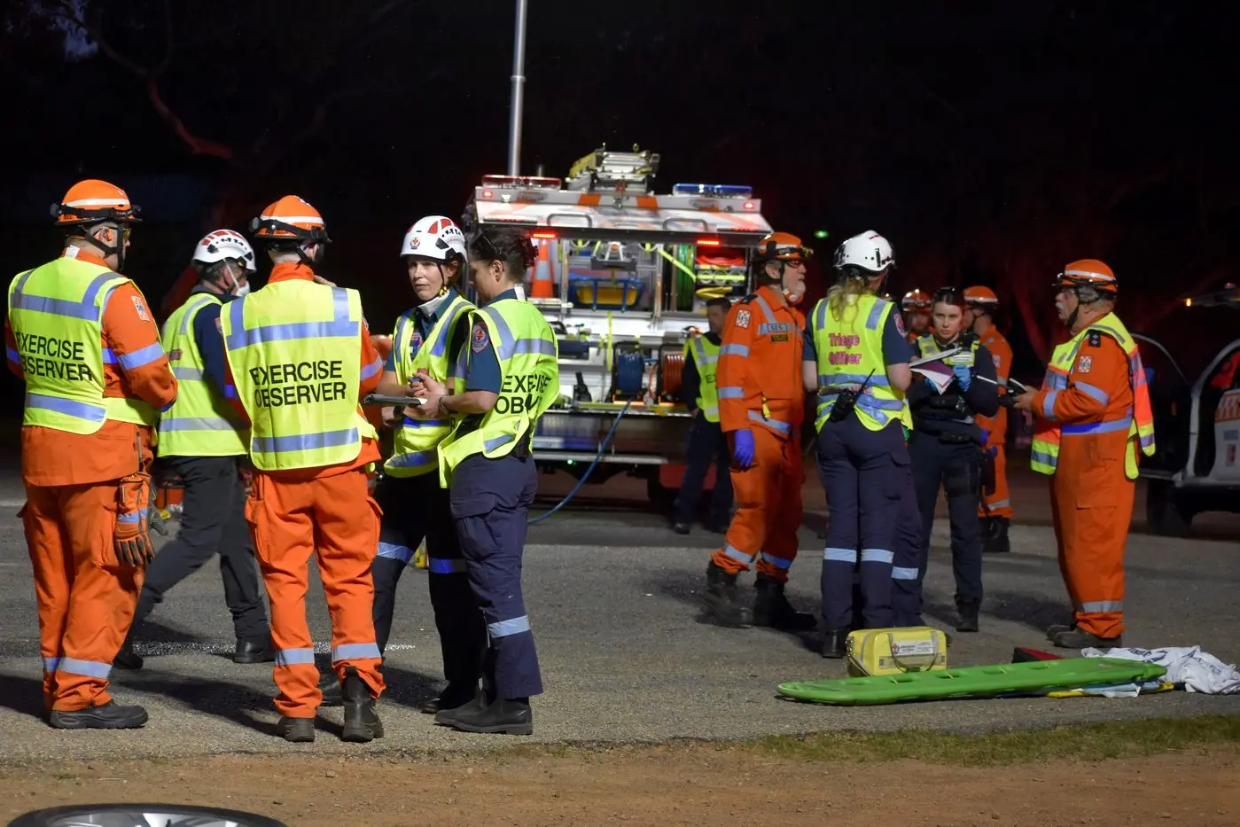 DISCUSSION: Throughout the exercise coaches and observers discussed any points to be revised. PHOTO: Pam Zierk-Mahoney
