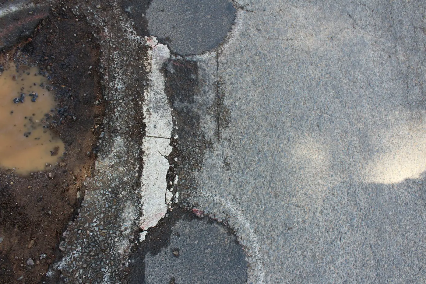 OBSTACLE COURSE: Potholes and deteriorating verges mark the stretch of road that is the Mansfield-Woods Point Road, just one of the many state-managed roads in the shire that have fallen into disrepair.