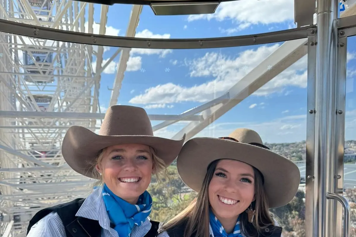SKYHIGH: A ride on the ferris wheel at the Melbourne Royal was part of the fun for Mansfield\\'s Annie Marquison (left) and Yarram\\'s Sheridan Venables. PHOTO: VAS