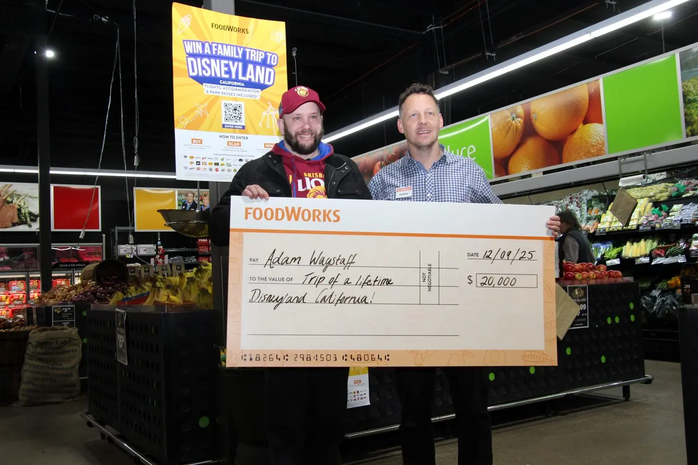 RETAIL JOY: Shopping local paid off for Adam Wagstaff (left) who was presented with a trip to Disneyland by Foodworks Mansfield manager Andrew Marshall last Friday. PHOTO: Lynn Elder