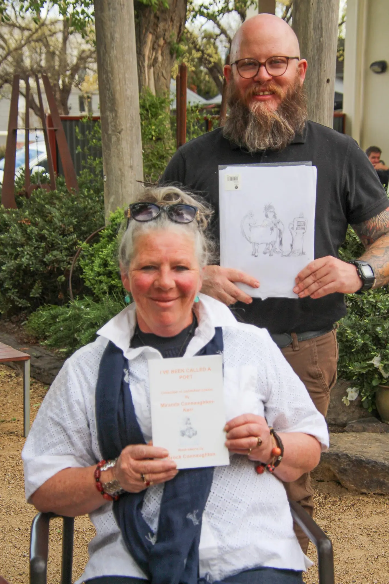 FAMILY AFFAIR: Miranda Connaughton with her book and son Brock who illustrated it with some of the drawings that featured. PHOTOS: Lynn Elder