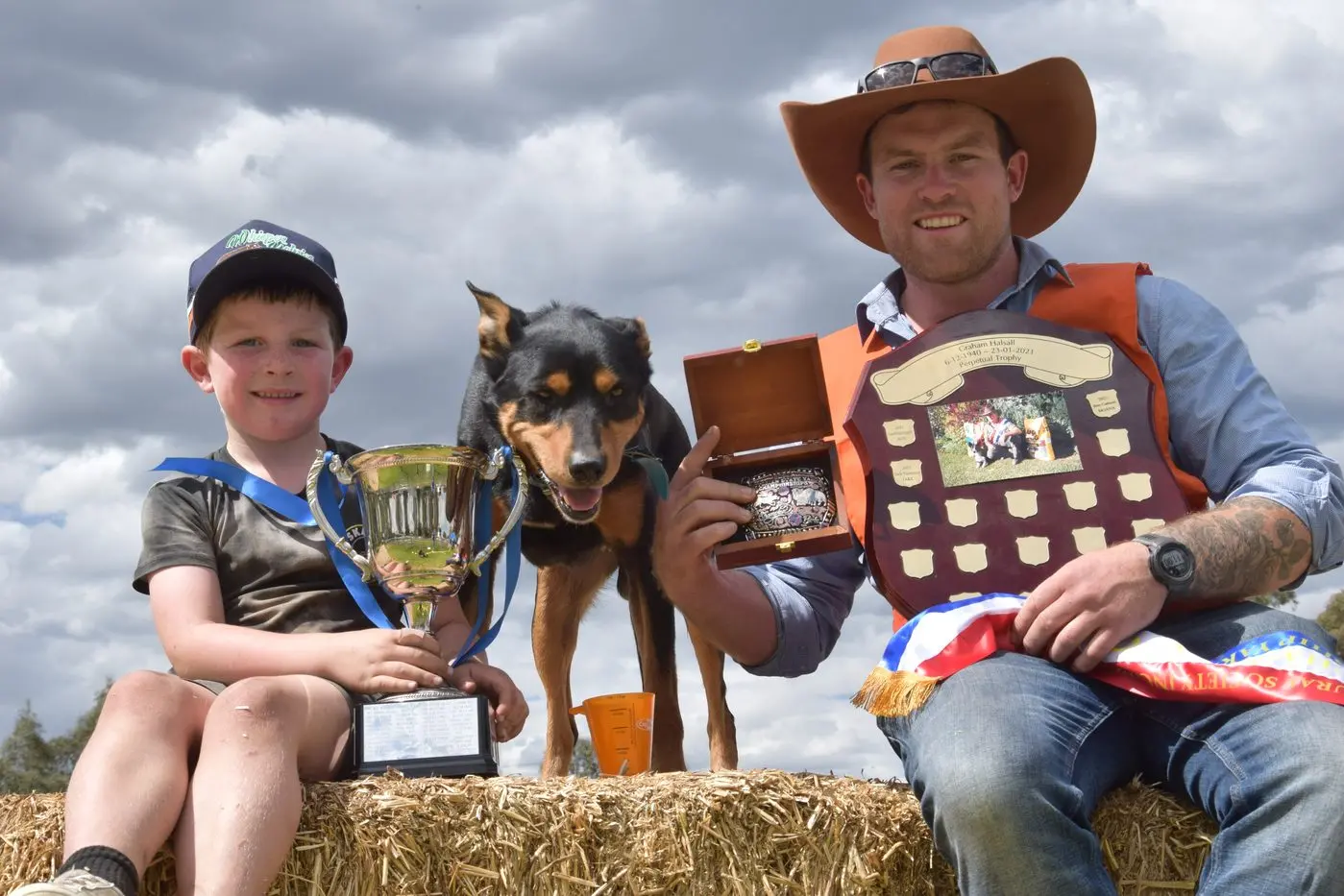 TOP DOG: Victorian Yard Dog Championship winner Aoidh Doyle (right) with son AJ and winning kelpie Cash, pictured at the Euroa Show on Sunday. PHOTO: Darren Chaitman