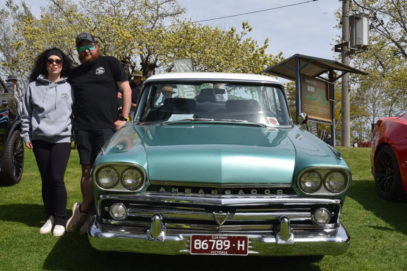 DARING TO DROP CONFETTI: With threatening white flakes atop the elm trees behind them, lovebirds Ruby Cumming and Andrew Ick from Mansfield show off Ruby\\u2019s stepfather\\u2019s 1959 Rambler Ambassador.\\nThe betrothed couple\\u2019s impending wedding comes with a caveat.