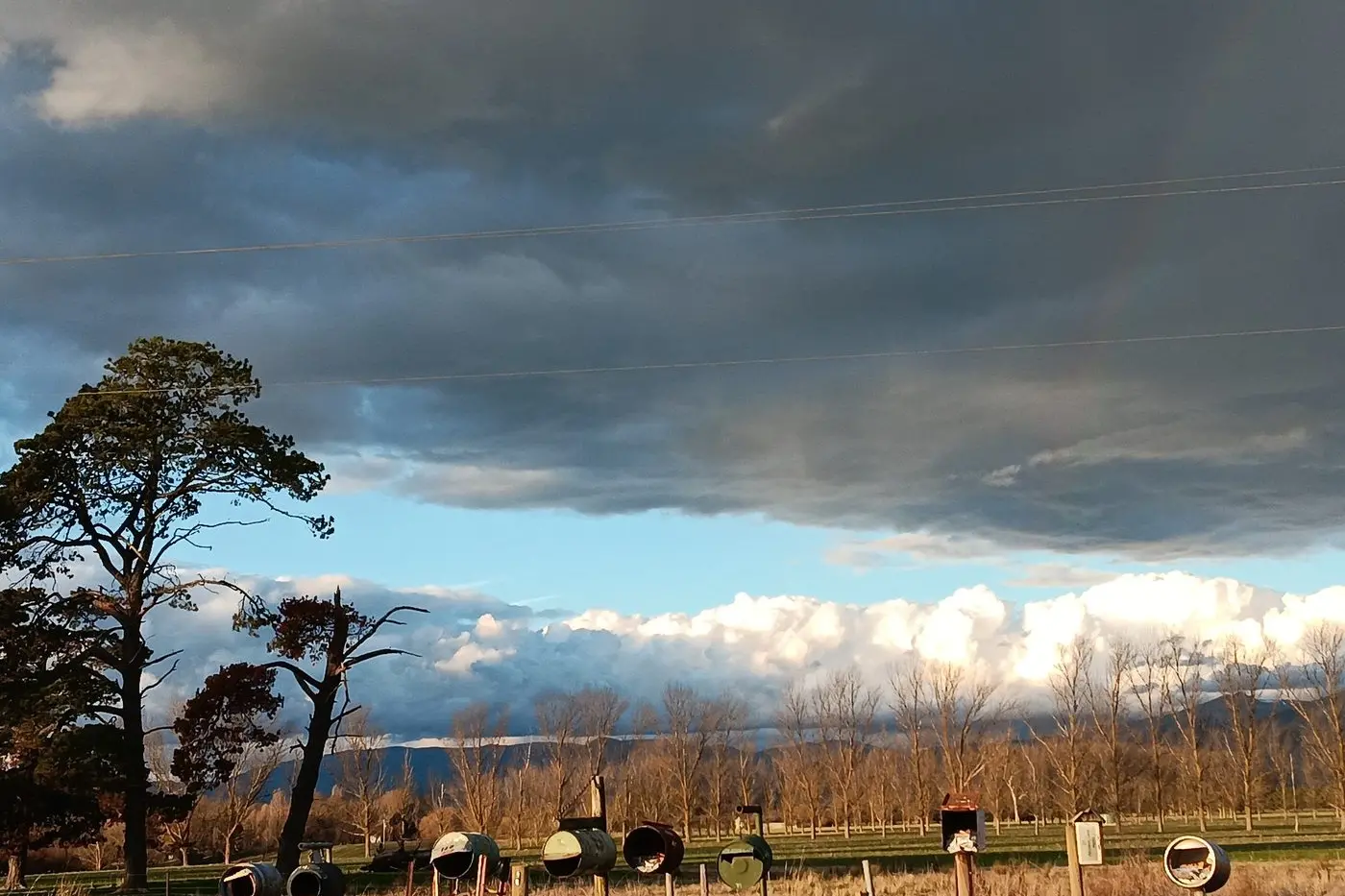 GATHERING STORM: A winter front rolls in over Piries, bringing welcome rain to a region still recovering from dry conditions. PHOTO: High Country Maze, Gardens and Gallery