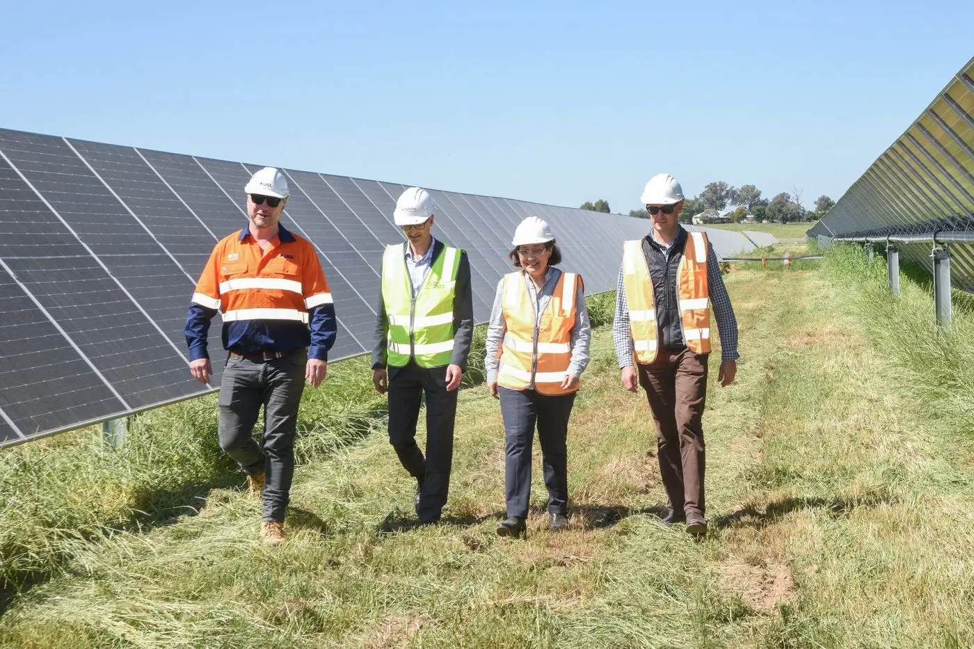 HEALTHY WORKFORCE: UGL construction manager Patrick McInerney showing managing director of Pacific Partnerships Simon Nicholls, Minister for the SEC Lily D\\'Ambrosio and SEC interim chief executive officer Chris Miller around the near completed Glenrowan Solar Farm. PHOTOS: Kurt Hickling