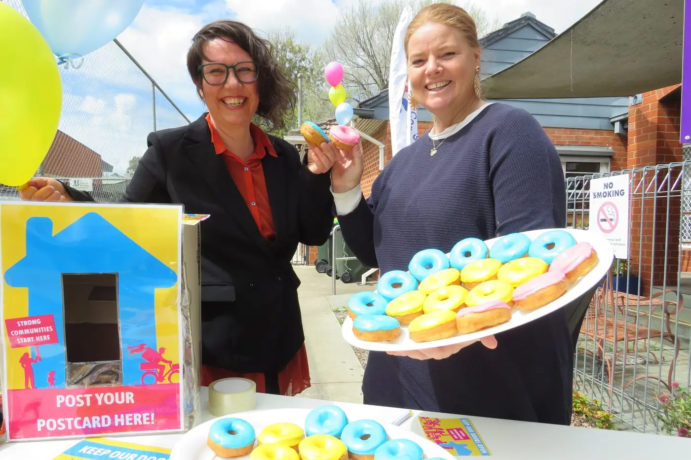 SEEKING SUPPORT: Open Door Neighbourhood House executive officer Loretta Waters and Pangerang Community Hub executive officer Tennille Hall are encouraging locals to support the Neighbourhood Houses Victoria \\'Keep Our Doors Open\\' campaign.  Pangerang held an event outside its Ovens Street base on Tuesday, to coincide with the Melbourne launch of the campaign, which is calling on the state government to increase annual funding to the sector to \\'sustainable levels\\'.  PHOTO: Simone Kerwin