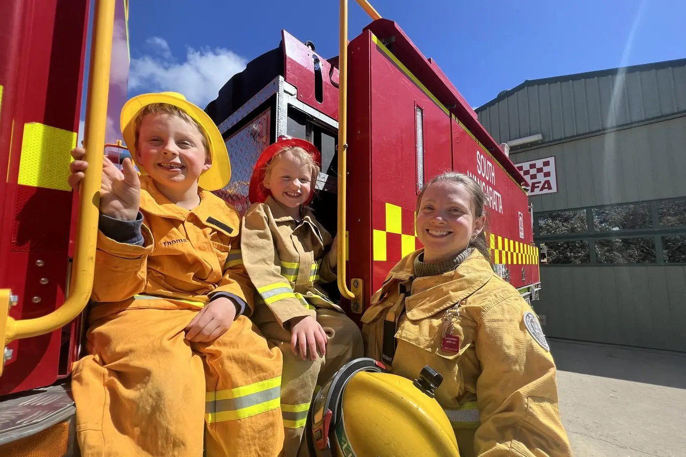 COME JOIN US: South Wangaratta CFA first lieutenant Tammy Thomas and her children James (7) and Millie (5) are inviting the community to visit the station tomorrow to join in their Get Fire Ready event. CFA brigades across the state are holding the events to help communities prepare and plan for the fire season ahead. PHOTO: Jeff Zeuschner