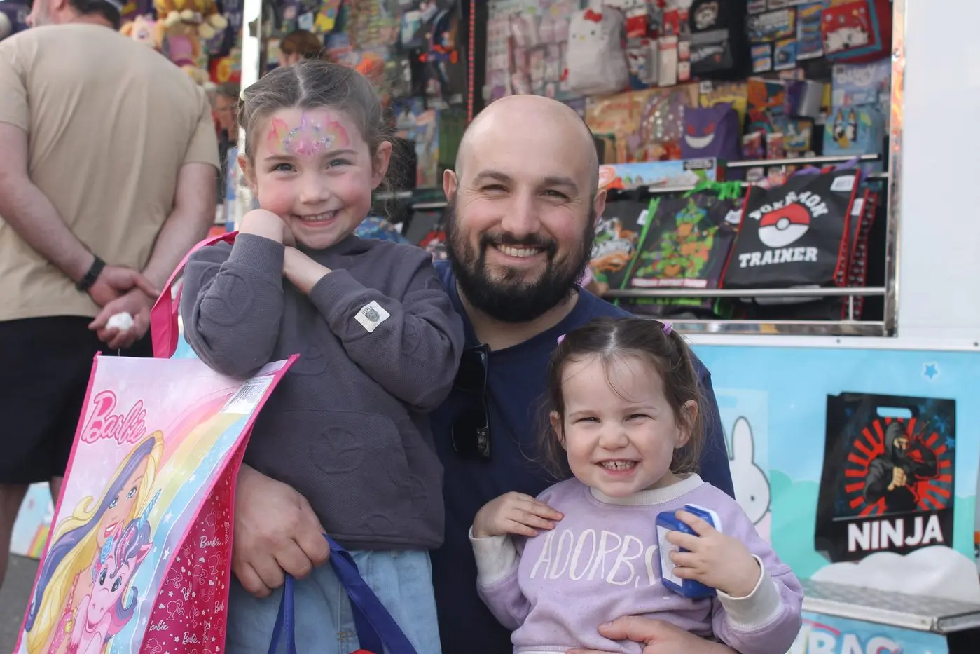 SMILES ALL ROUND: Emma (left), Nick and Zoey Sgarioto were one of many families happy in the festive spirit on Saturday afternoon at the Wangaratta Show. Around 4000 people went through the gates at the Wangaratta Showgrounds on Friday and Saturday. PHOTO: Grace Fredsberg