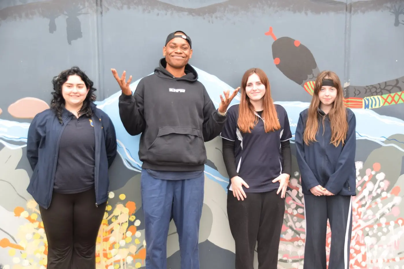 WELCOME VISITOR: Rapper JK47 with Wangaratta High School students Lillian Oats-Mason, Ashley Course and Daizy Thomson during his visit for Positive Minds Day.  PHOTO: Kev McGennan\\n