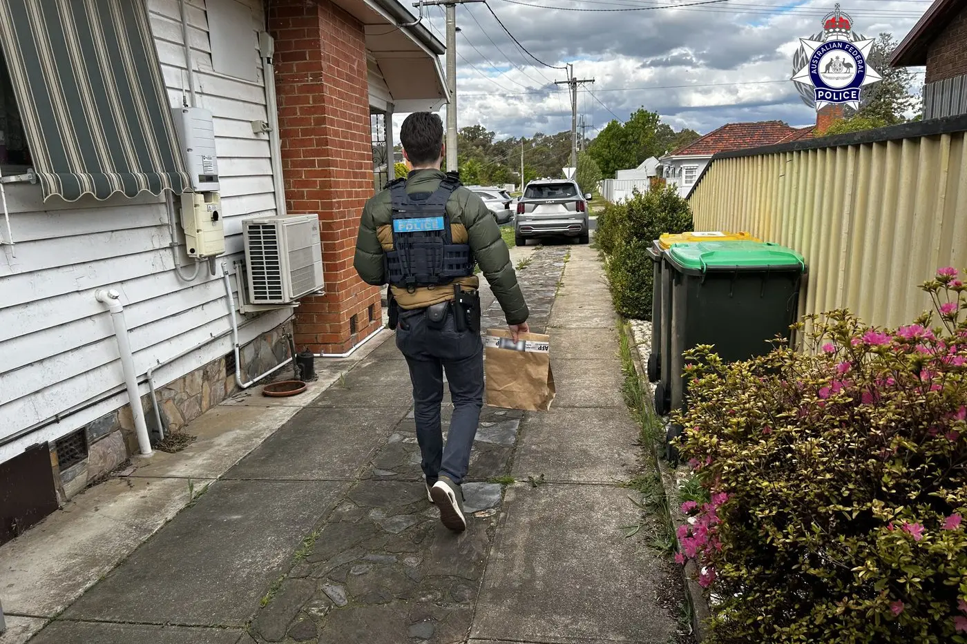 ZERO TOLERANCE: Australian Federal Police members searched the home of a Wangaratta man on 1 October last week after he was charged with possession and soliciting child abuse material by the Australian Border Force on 27 September. PHOTO: AFP