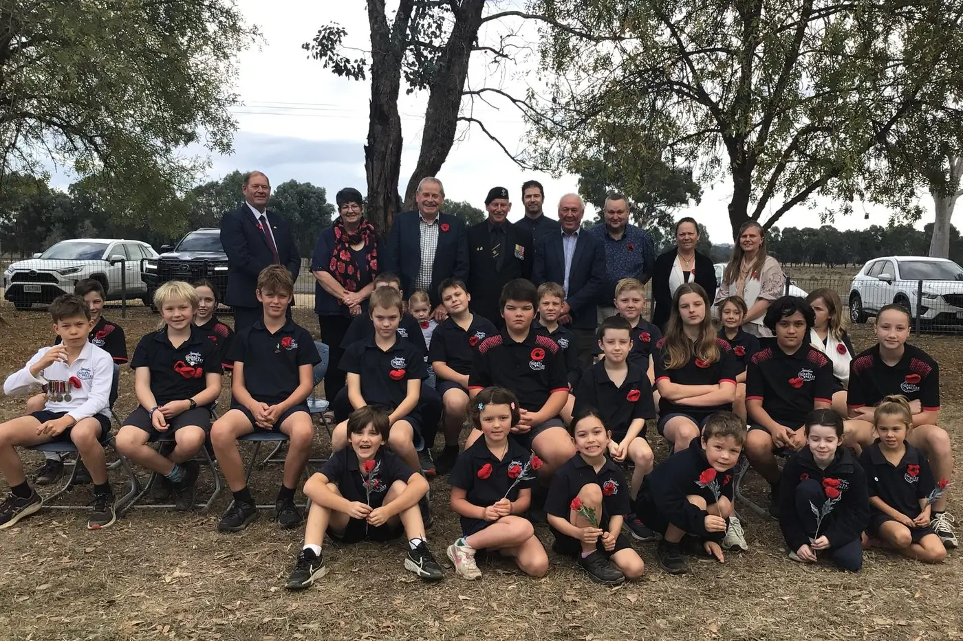 POSITIVE EXPERIENCE: Greta Valley Primary School students, with principal Howard Gibson and special guests, commemorate Anzac Day each year in a way which has long term benefits for all.