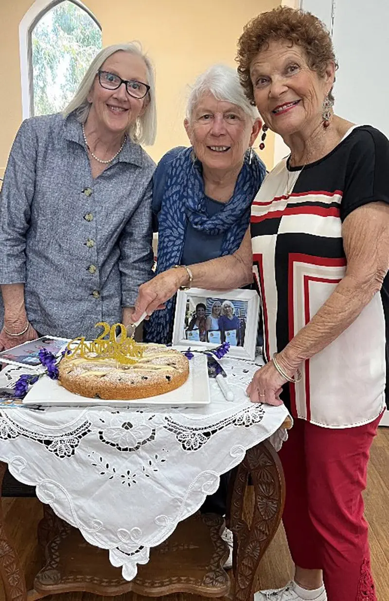 SOCIAL CONNECTION: Robyn Cole, Gillian Kimber and Lynn Gent cut the cake to mark 20 years since the Glenrowan Drop-In Centre was established at St Paul\\u2019s Anglican Church Hall.