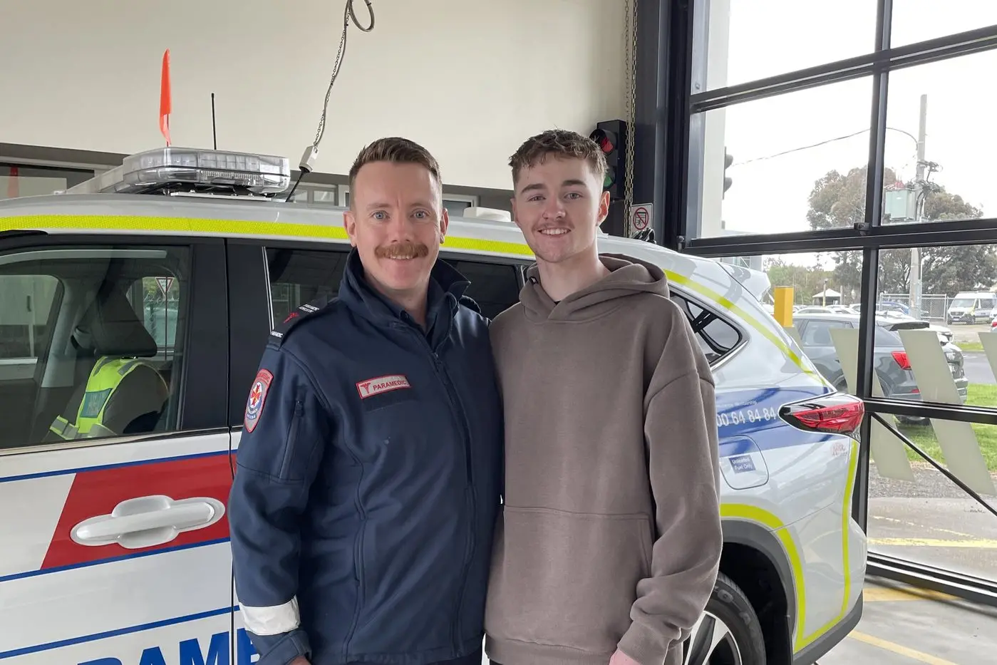 STAY PROTECTED: Ryan Leitch with Robert Van Der Toorren, one of the paramedics who assisted him after he plowed through a fence on his motorbike while riding home.