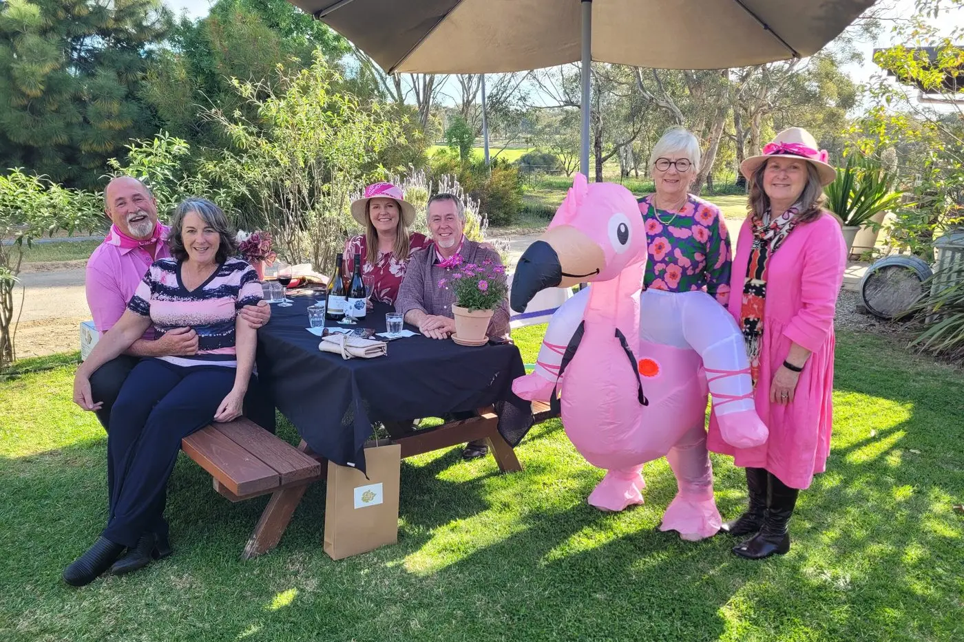 FUN: Stanley\\u2019s Lou and Anne Sirca (left), Leanne Vickers, Rob Dickie, winner of the most creative use of pink Wendy Kelly with Indigo Vineyard\\u2019s Kim Rowley at the \\u2018Garden Party. PHOTOS: Coral Cooksley