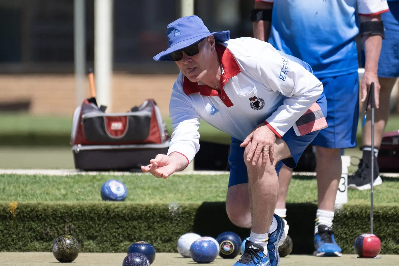 LET IT ROLL: Darren Simpson lets one go down the green, as his rink went down 15-22 on Saturday in Wangaratta. PHOTOS: Melissa Beattie