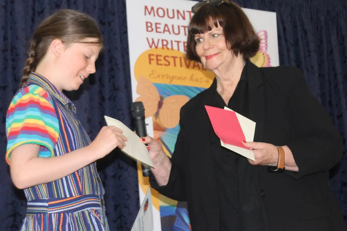 WRITE YOUR WAY TO THE TOP: Last year\\'s Mount Beauty Youth Writing Competition Winner Florence Roberts accepted her prize from festival founder Fay Mason. PHOTO: Phoebe Morgan