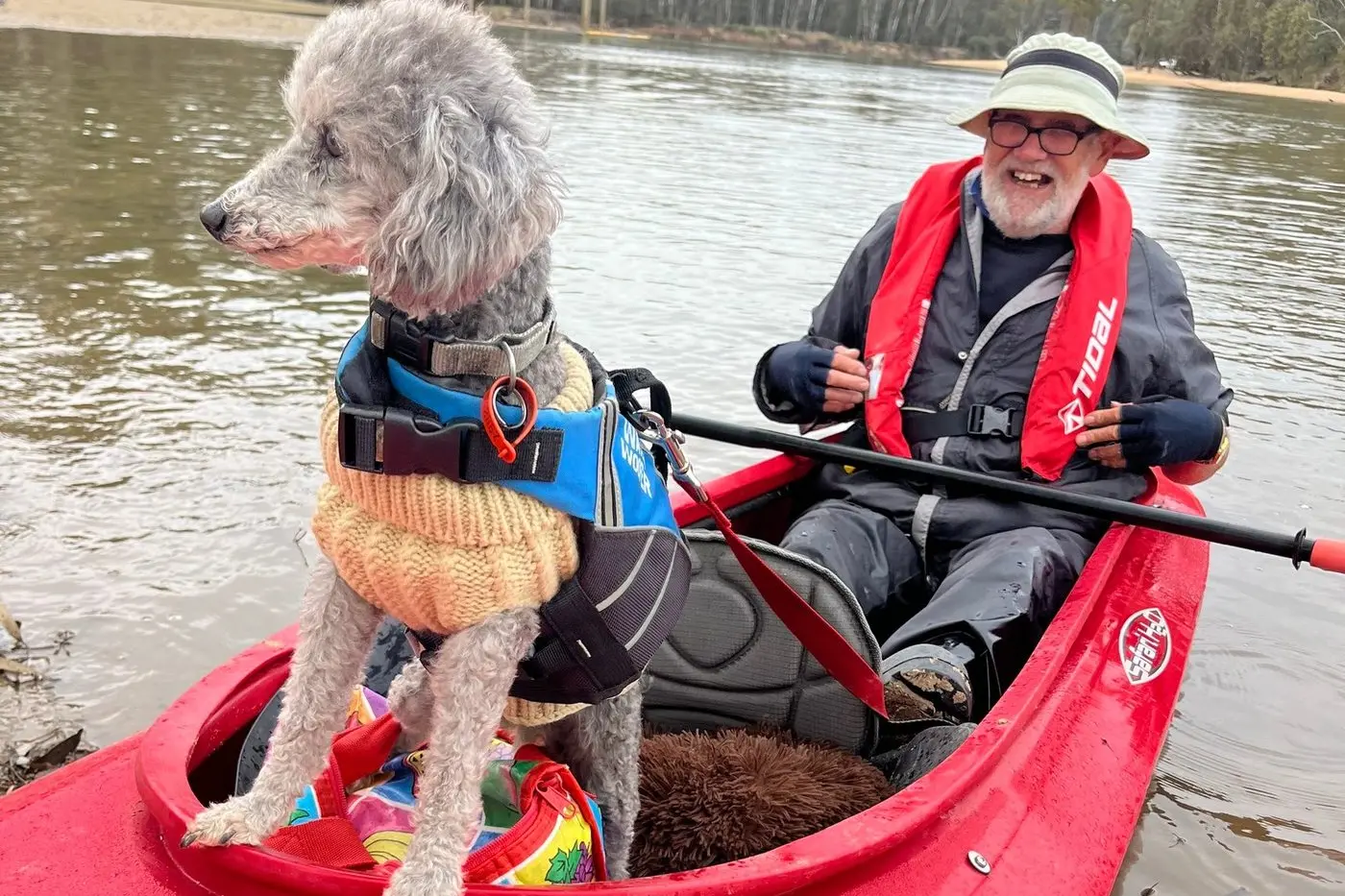 PADDLE PERFECT: Peter Dixon and Maggie the poodle enjoyed the perfect weather and the beautiful scenery on the latest leg of their kayaking trek.