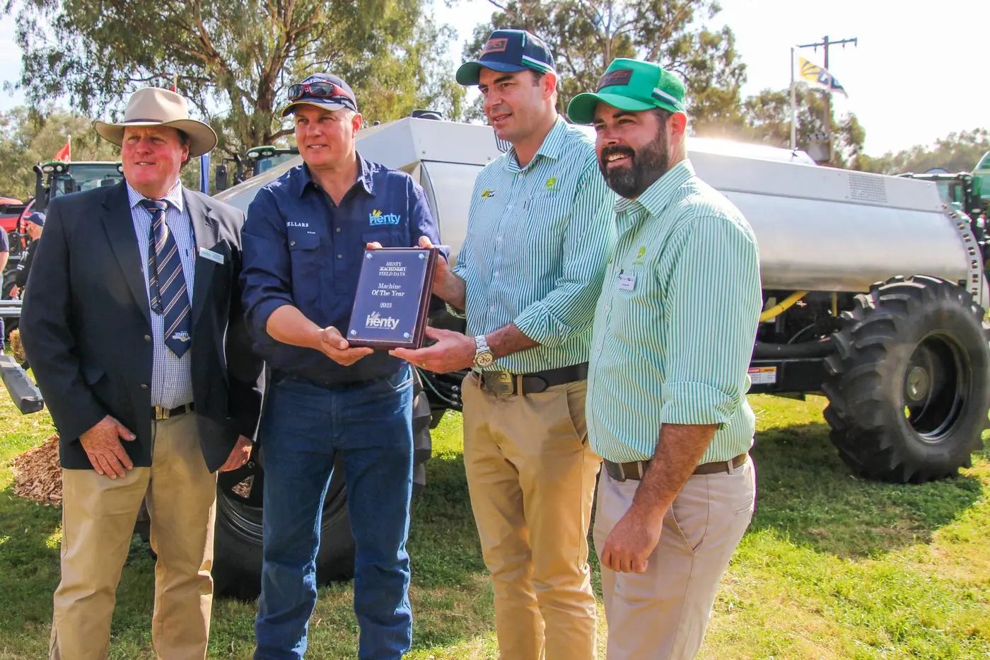 WINNING SMILES: Presenting the 2023 Henty Machine of the Year Award is HMFD chairman Nigel Scheetz (left) and judge Warren Scheetz to Aron Hutcheon and Andrew Watt from Hutcheon and Pearce. PHOTO: Lynn Elder