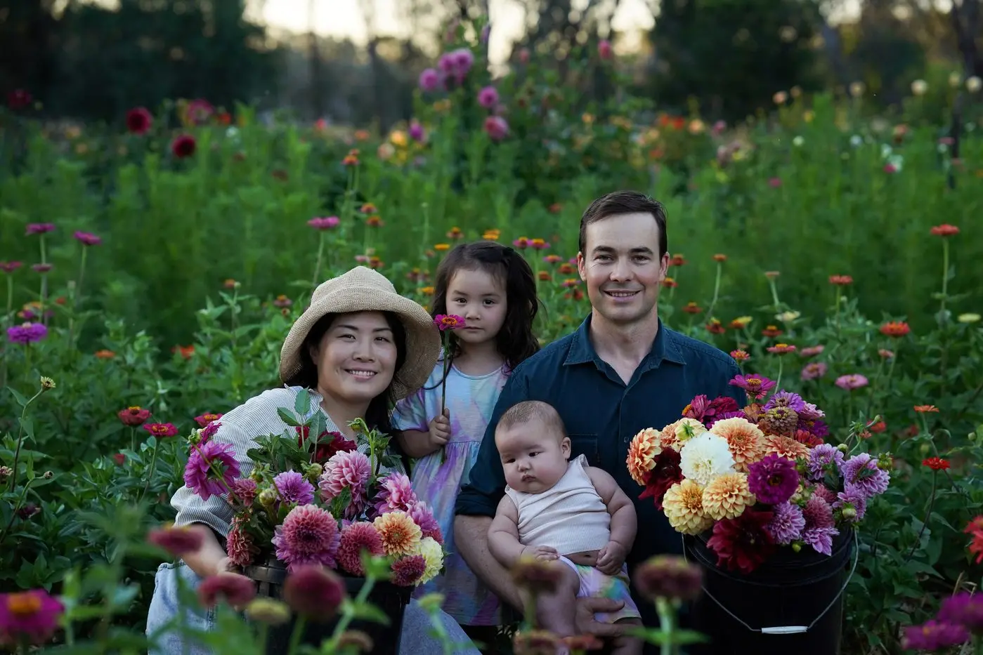 FAMILY AND FLOWERS: Arisa, Poppy, Jack and Sage Herry  with their bright blooms at Herry\\'s Harvest. PHOTOS: Arisa Herry 