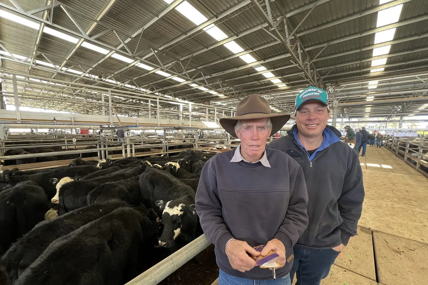 GOOD REWARD: Merrijig cattle farmers Steven and Adam Mahoney brought in great returns for their 75 black baldy cattle sold at the sale following a tough season in the region. PHOTOS: Jeff Zeuschner