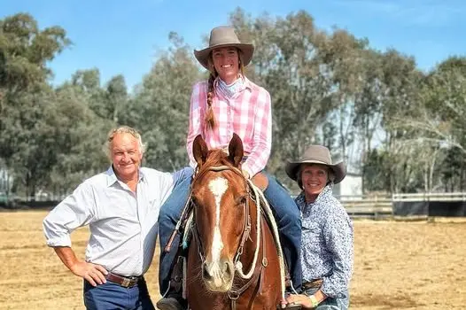 FAMILY AFFAIR: Proud parents Graham and Anne Maree Forge with daughter Tup at their Oxley cattle property. PHOTO: Supplied