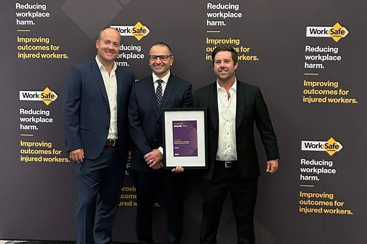 LOCAL START-UP: James, left, and Paul Diamond, right, AirAgri, accept their award from Worksafe Victoria chief executive officer Joe Calafiore at the 34th annual Worksafe Awards.