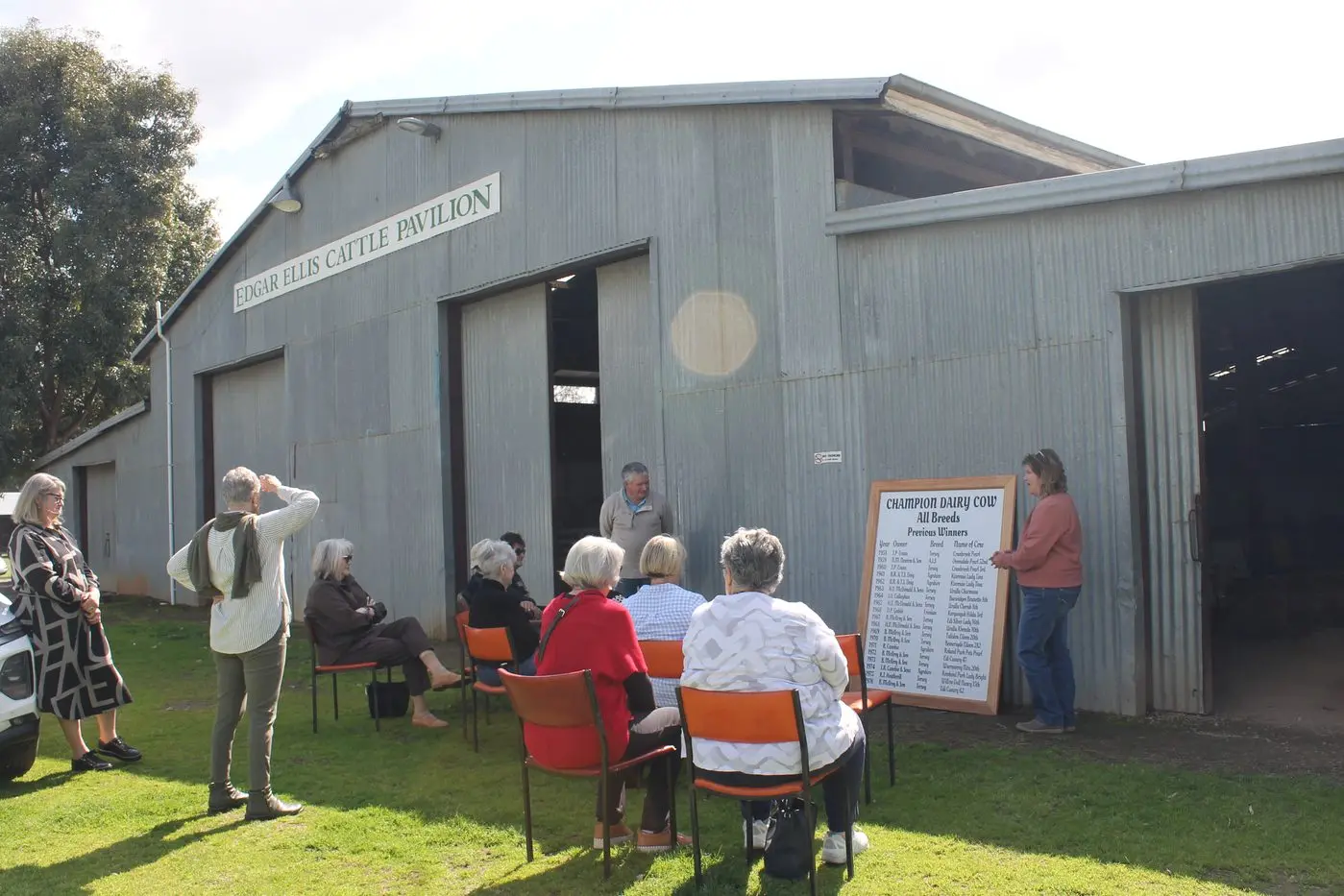 SIGNIFICANT OCCASION: Charmane Bennett unveiling the replica sign alongside Wangaratta Show president Stan Goldsworthy.
