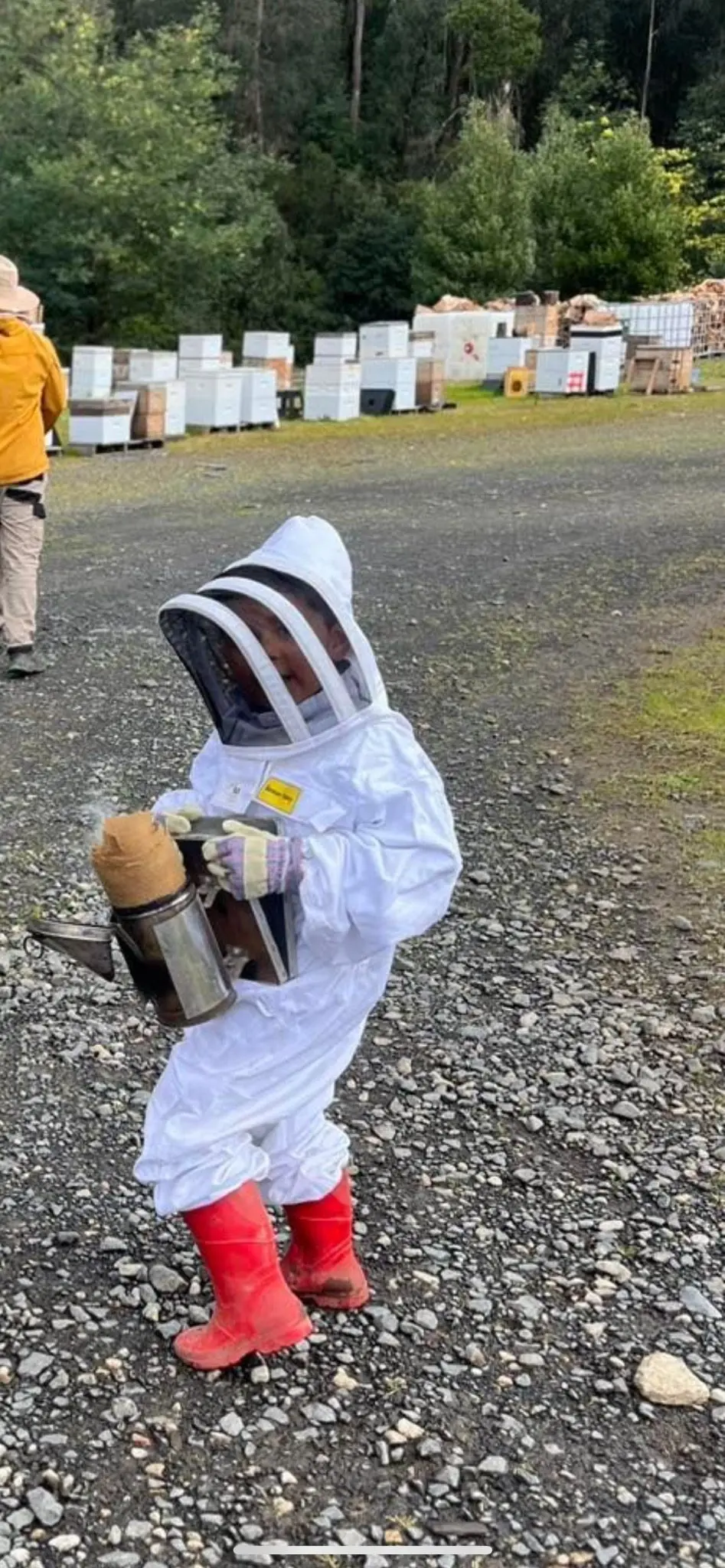 FAMILY AFFAIR: Jai following in the footsteps of his beekeeper father. PHOTO: Supplied