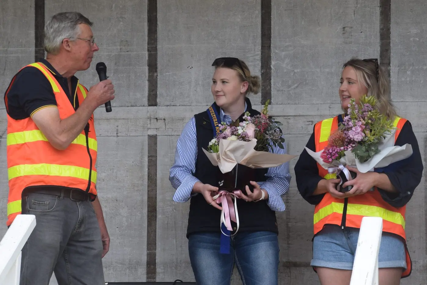 AMBASSADORS: Euroa Agricultural Society president Andrew Douglas presented the VAS junior Ambassador Award to Teagan Kubeil (left) and the VAS Ambassador Award to Cassandra Douglas.  PHOTO: Darren Chaitman